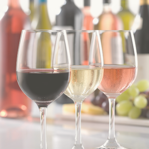 A group of wine glasses with different types of wine in them