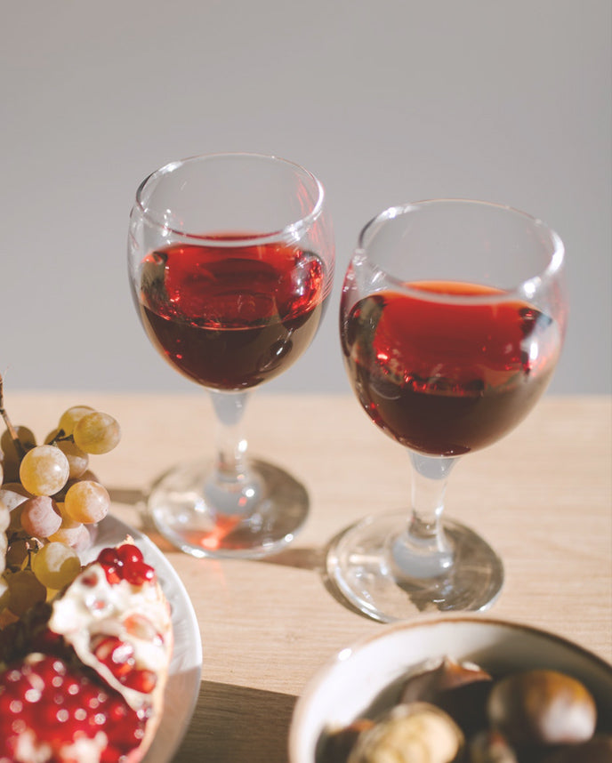 glasses of pinot noir with fruits and nuts