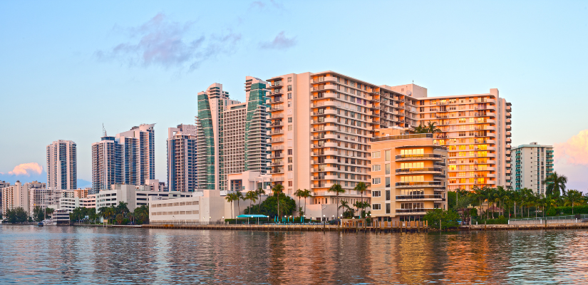 Hollywood Florida, illuminated buildings at sunset reflected in water