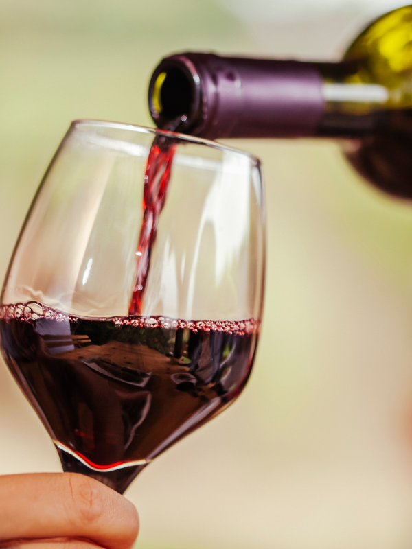 red wine being poured in the glass