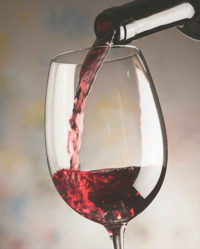 red wine being poured to a wine glass