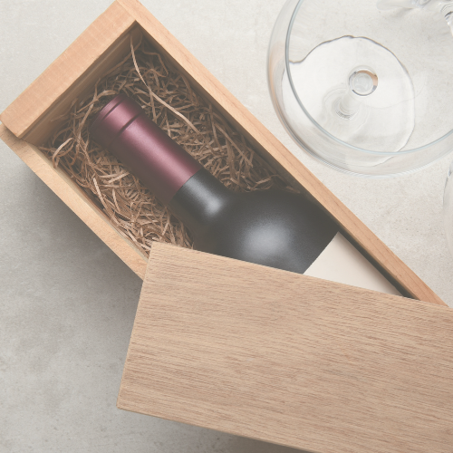 a single bottle of wine in a wood box partially covered by the lid