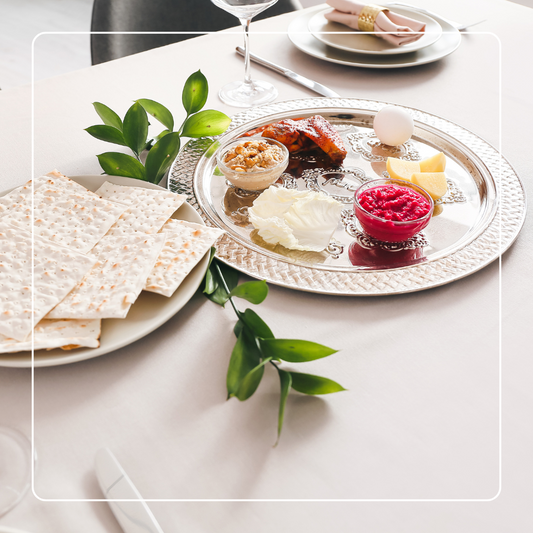 A Passover Seder plate displaying various symbolic foods, representing the Jewish tradition during the Passover holiday.