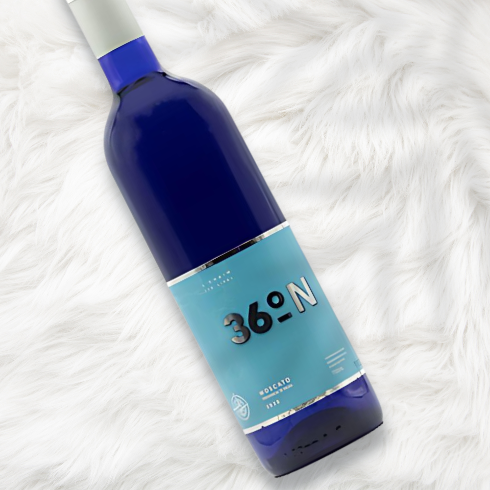bottle of 36 Degrees Notrh Moscato laying on a white carpet