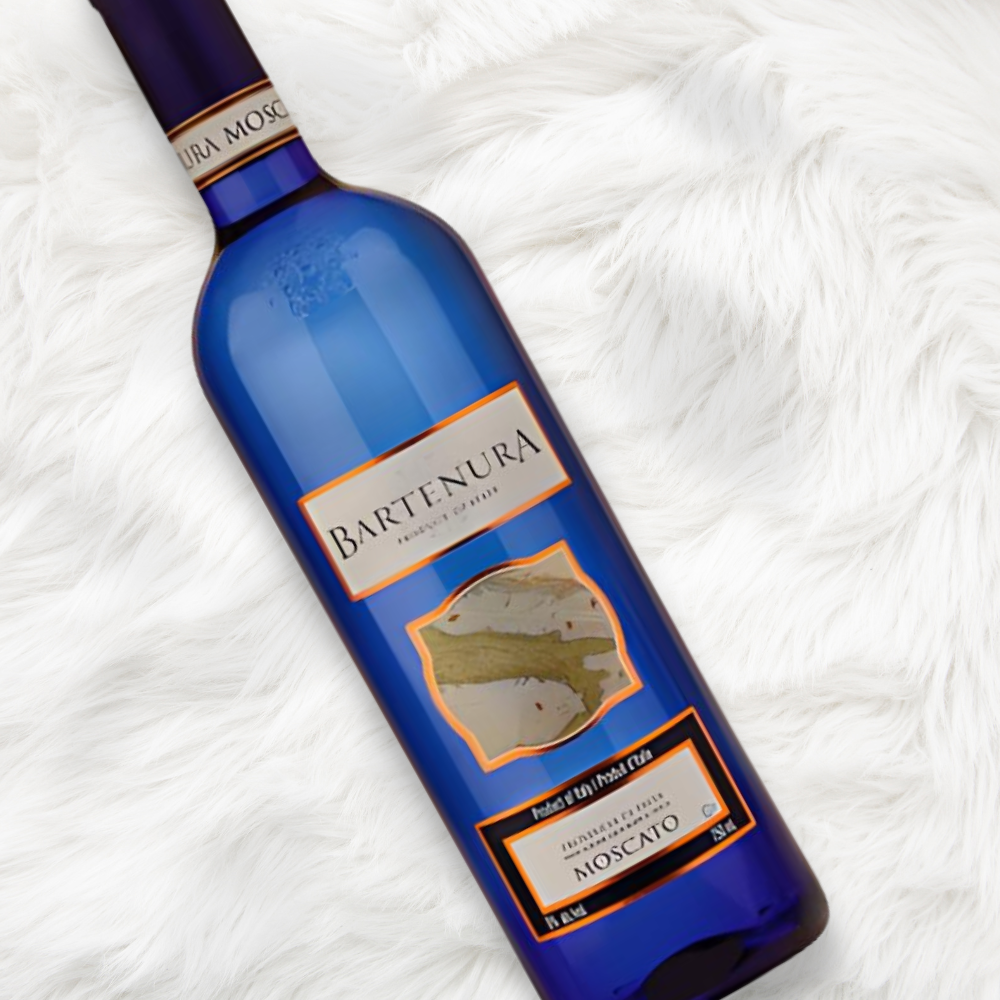 bottle of Bartenura Moscato laying on a white carpet