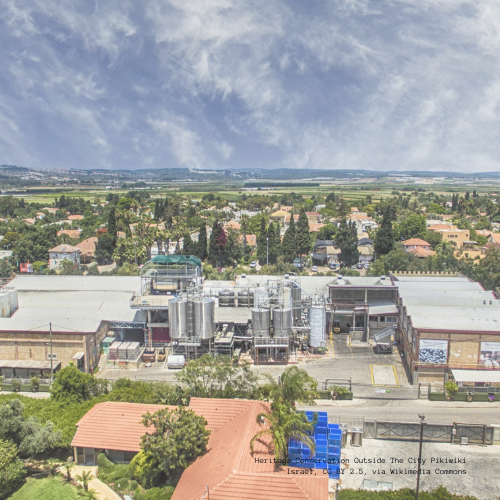 Aerial view of Binyamina Winery with surrounding landscape and buildings.