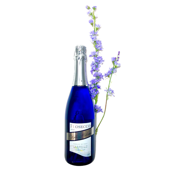 Bottle of Prosecco Notte Italiana flanked by sprigs of lavender-colored flowers