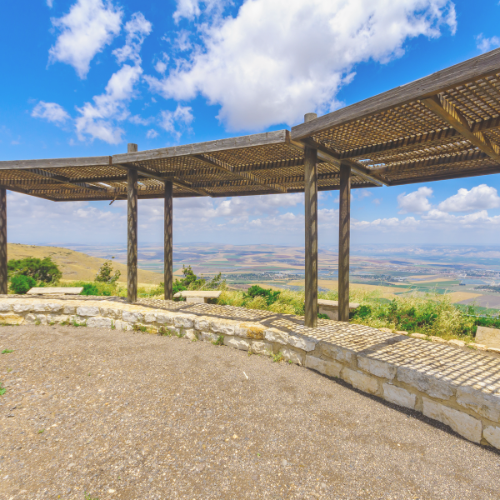 Scenic view from Gilboa Ridge with wooden pergola and expansive landscape.