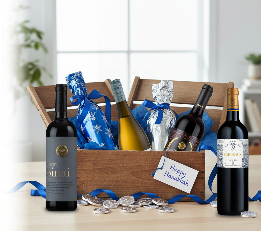 Wine bottles in a wooden crate with 'Happy Hanukkah' tag, surrounded by blue ribbons and coins on a light background.
