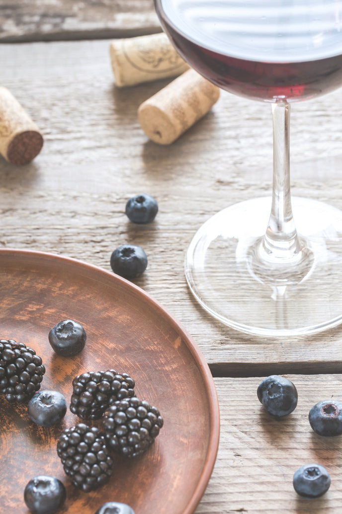 malbec wine beside blueberries