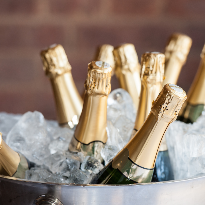 champagne bottles on a bucket of ice