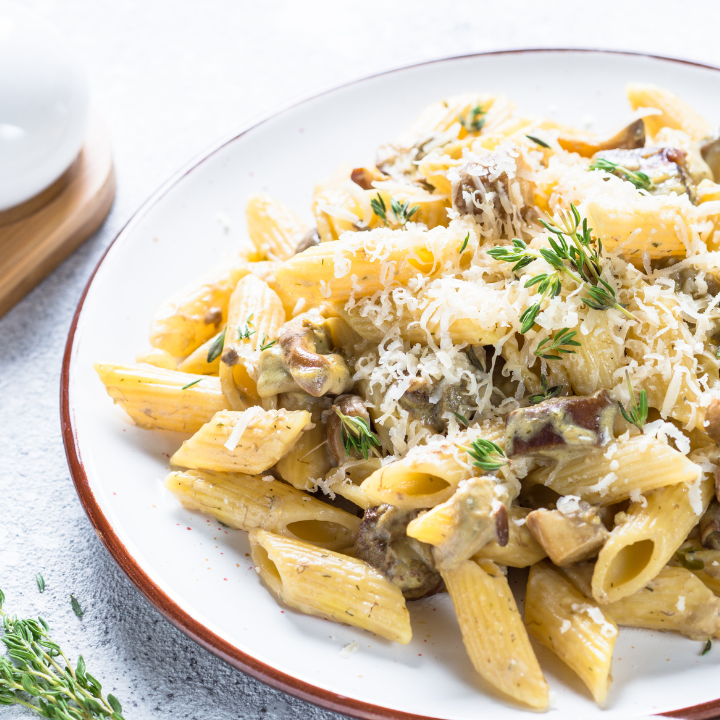pasta with white mushrooms in creamy sauce