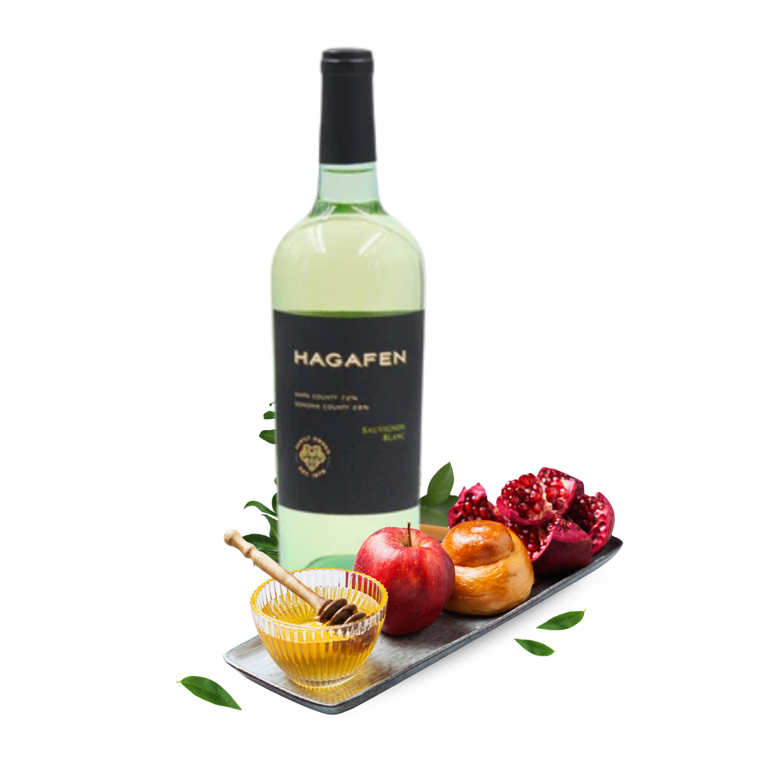 Bottle of Hagafen wine with apples, pomegranate, and honey on a white background