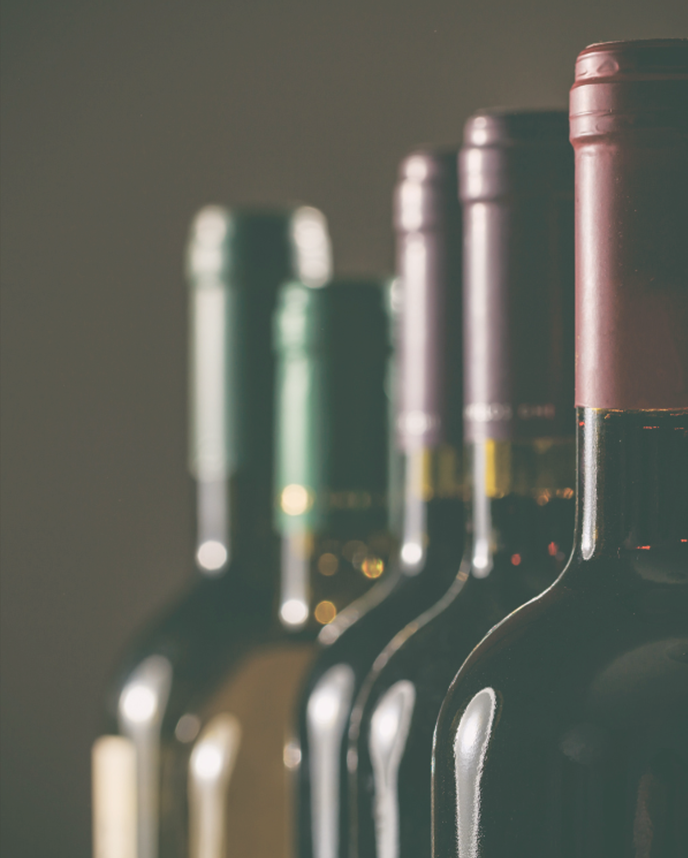 selection of wine bottles on black background